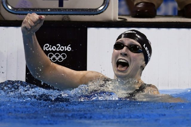 USA's Katie Ledecky won the women's 400m freestyle in 3min 56.46sec, smashing her own worl