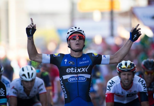 Etixx Quick Step's cyclist Gianni Meersman celebrates as he crosses the finish line winnin