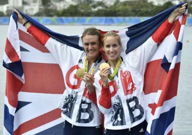 Britain's Heather Stanning (L) and Helen Glover pose with their medals on the podium of th