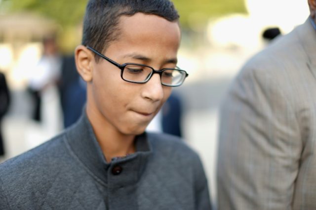 Fourteen-year-old Ahmed Mohamed (R) of Irving, TX, arrives for a news conference outside t