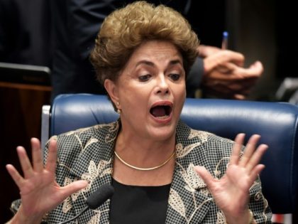 Impeached Brazilian President Dilma Rousseff gestures during her testimony in her impeachment trial at the National Congress in Brasilia
