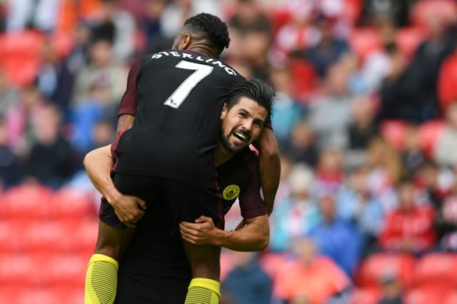 Manchester City's midfielder Nolito (R) celebrates with Raheem Sterling after scoring thei