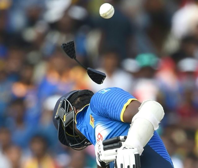 Sri Lanka's captain Angelo Mathews is hit on the helmet by a ball off the bowling of Austr