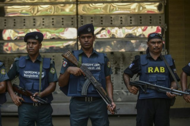 Bangladeshi security personnel stand guard in Dhaka on May 10, 2016