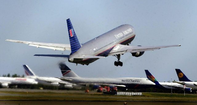 Two American pilots were charged on Monday with being under the influence of alcohol at a