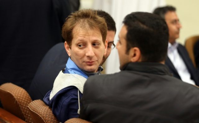 Babak Zanjani (centre) in court in Tehran in March this year