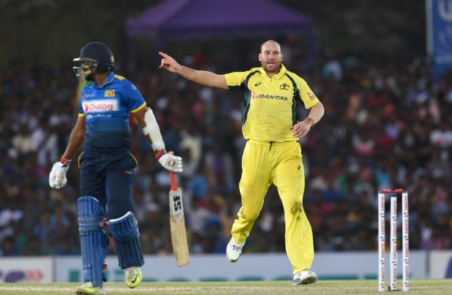 Australia's John Hastings (R) celebrates the dismissal of Sri Lanka cricketer Dilruwan Per