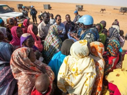 Displaced women discuss their concerns with UNAMID personnel at Zam Zam camp for internall