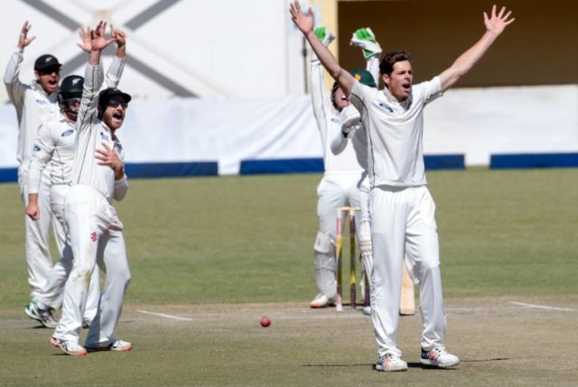 New Zealand bowler Mitchell Santner (right) and teammates appeal for a wicket on the fifth