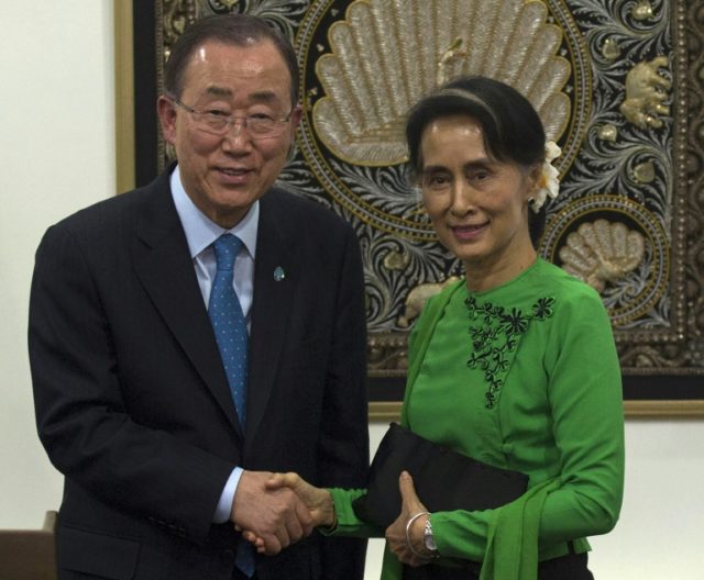 UN Secretary General Ban Ki-moon (L) and Myanmar State Counsellor Aung San Suu Kyi shake m