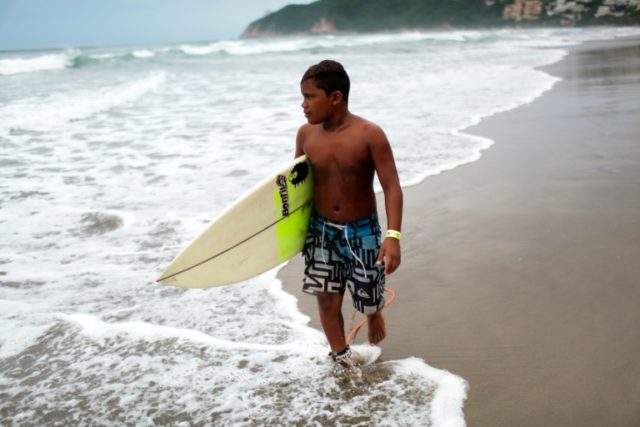 Ten-year-old Gaciel Garcia takes part in Acapulco Surf Open, in the Mexican state of Guerr