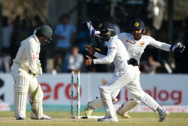 Sri Lanka celebrate the dismissal of Australian batsman Usman Khawaja on the second day of