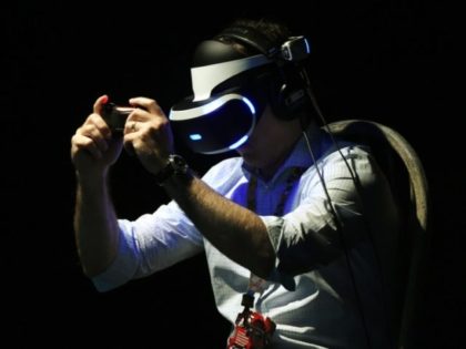 A gamer tests a new virtual reality game headset at the Electronic Entertainment Expo in Los Angeles, California