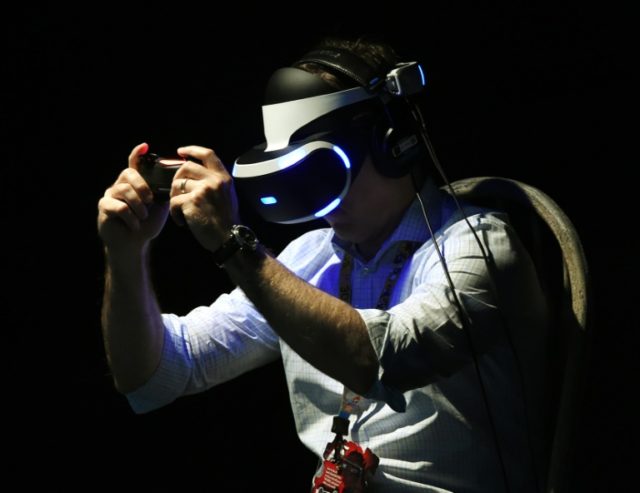 A gamer tests a new virtual reality game headset at the Electronic Entertainment Expo in L
