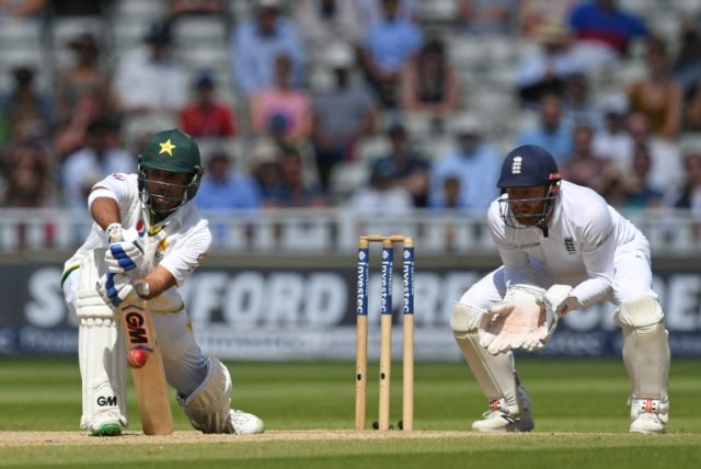 Pakistan's Sami Aslam (L) hits a forward defensive as England's Jonny Bairstow keeps wicke