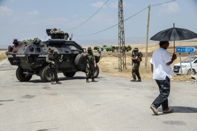 Turkish soldiers guard a check point in the troubled southeast of the country