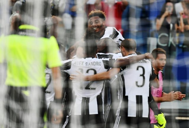Juventus' players celebrate after teammate Juventus' midfielder from Germany Sami Khedira
