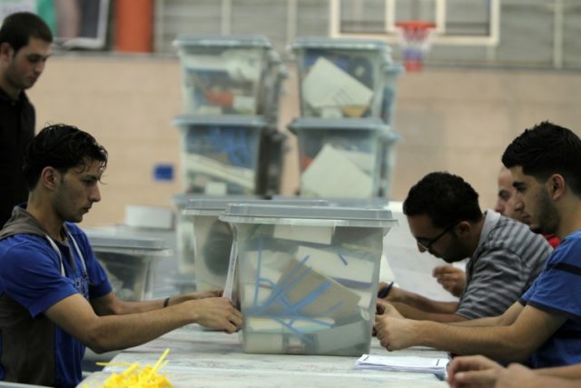 Palestinian officials prepare ballot boxes in Ramallah on October 17, 2012 prior to munici