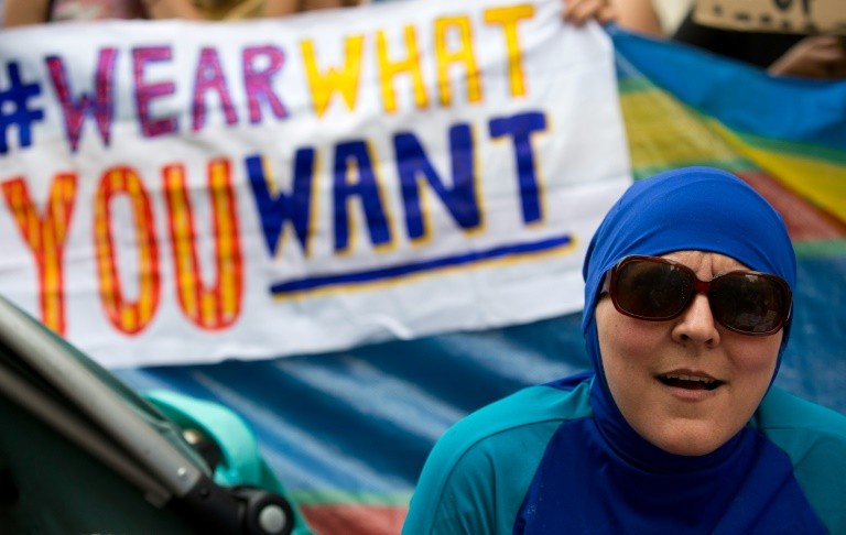 A woman wearing a burkini joins a protest outside the French Embassy in London on August 25, 2016