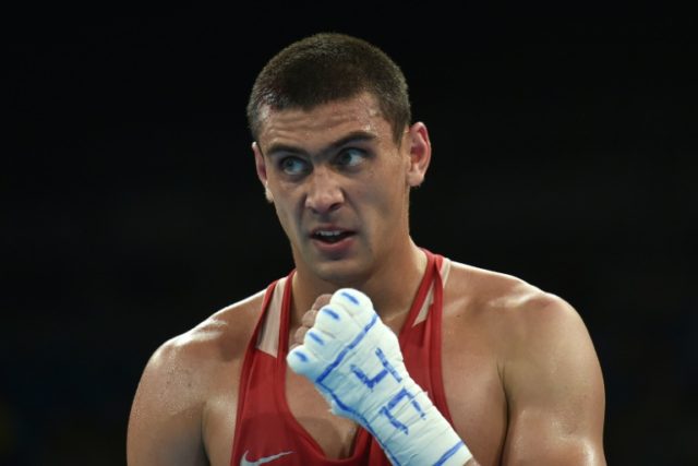 Russia's Evgeny Tishchenko reacts to winning against Kazakhstan's Vassiliy Levit during th