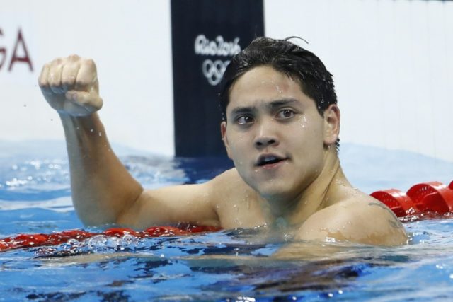 Singapore's Joseph Schooling, 21, won the 100m butterfly final in a Games record 50.39sec