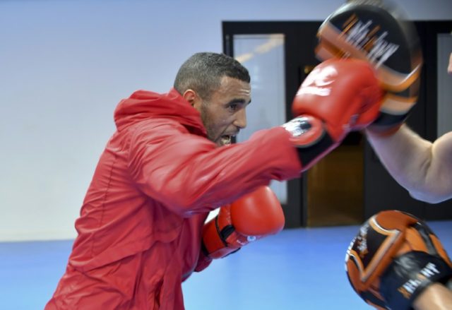 Moroccan boxer Hassan Saada, pictured in training with his coach at the Riocentro complex