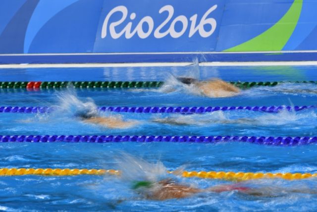 Swimmers train at the Olympic Aquatics Stadium ahead of the Rio 2016 Olympic Games in Rio