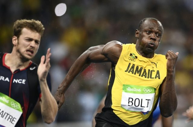 Usain Bolt (right) and France's Christophe Lemaitre compete in the men's 200m final in Rio