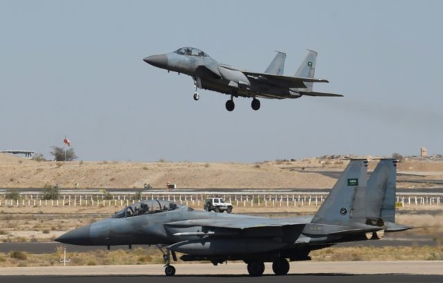 A Saudi F-15 fighter jet lands at the Khamis Mushayt military airbase
