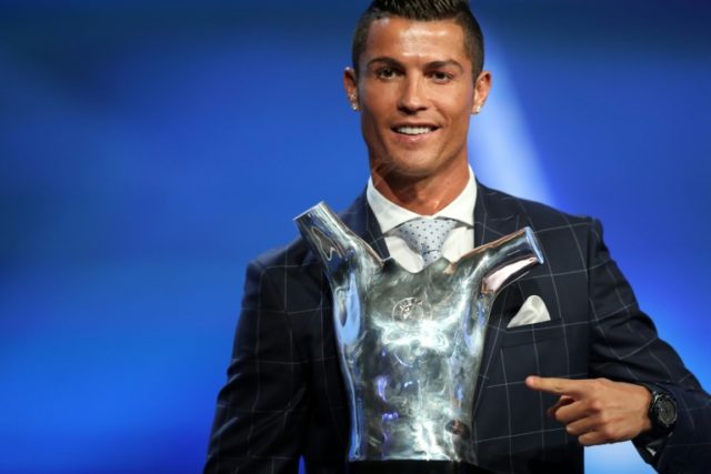Real Madrid's Portuguese forward Cristiano Ronaldo poses with his trophy of Best Men's Pla