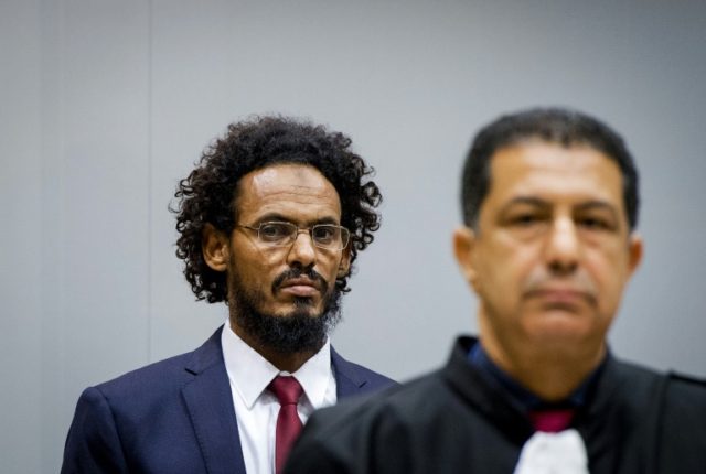 Ahmad Faqi Al Mahdi (left) is charged with orchestrating attacks on the Malian city of Tim