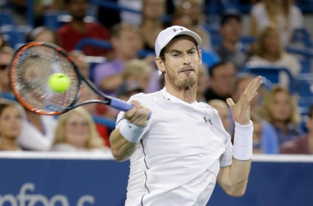 Andy Murray hits a return in the semi-final match against Milos Raonic at the ATP-WTA Cinc