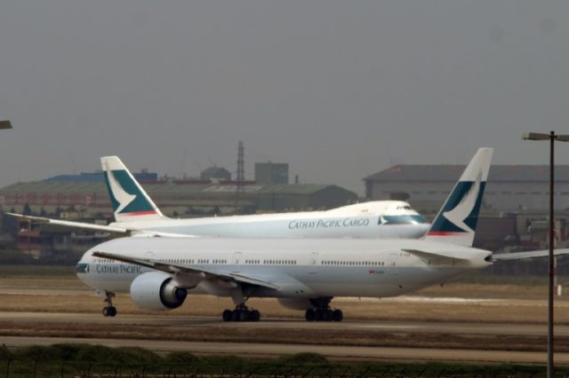 Cathay Pacific said its first-half profit dropped 82 percent from a year earlier due to a