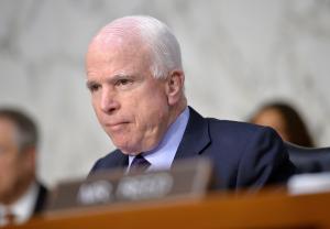 John McCain looks to fend off conservative challenger in Arizona primary