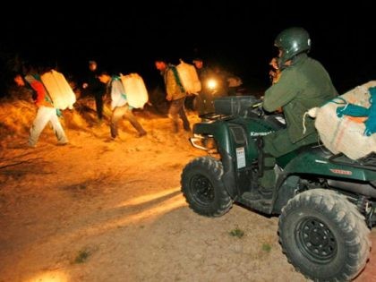 Bartletti, Don –– – MARCH 19, 2009. RODEO, NEW MEXICO. Veteran U.S. Border Patrol tracker Rogelio Villa and other agents move smugglers through the desert. The marijuana backpack on his ATV has blue shoulder straps fashioned from blankets. Villa and his team tracked the suspects for 6 hours before surrounding …