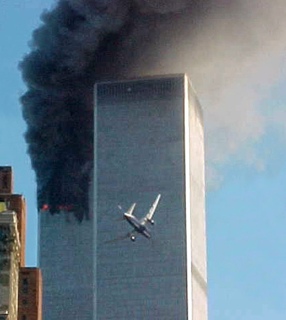 ** ADVANCE FOR TUESDAY, NOV. 4, 2008 AND THEREAFTER ** FILE ** In this Sept. 11, 2001 file photo, a jet airliner nears one of the World Trade Center towers in New York. For all of the candidates' talk about the need for change, Americans have seen plenty of it since the last time they selected a new leader - including the attack on the World trade Center in 2001. (AP Photo/Carmen Taylor/File)