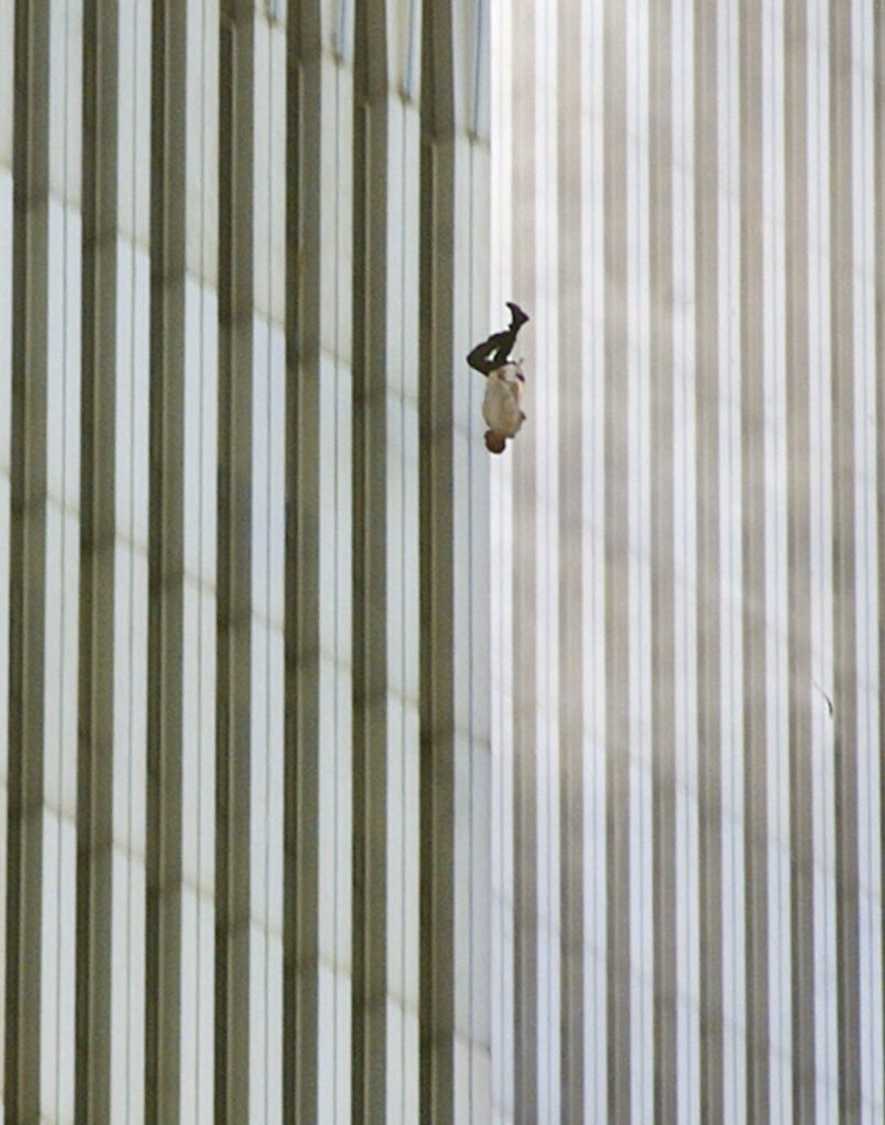 EDITORS: NOTE GRAPHIC CONTENT--- A person falls headfirst from the north tower of New York's World Trade Center Tuesday, Sept. 11, 2001. (AP Photo/Richard Drew)
