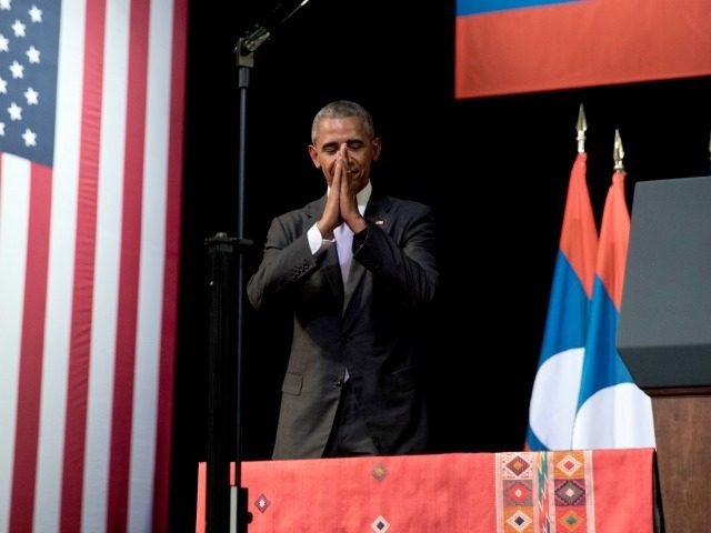 U.S. President Barack Obama bows to the audience after speaking at the Lao National Cultur