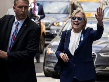 Democratic presidential candidate Hillary Clinton waves as she walks from her daughter