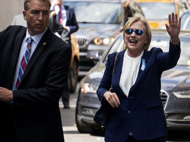 Democratic presidential candidate Hillary Clinton waves as she walks from her daughter&#03