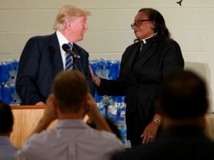 Rev. Faith Green Timmons interrupts Republican presidential candidate Donald Trump as he spoke during a visit to Bethel United Methodist Church, Wednesday, Sept. 14, 2016, in Flint, Mich.