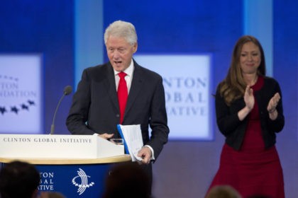 Former U.S. President Bill Clinton moves to the podium after being introduced by his daughter, Chelsea Clinton, on the final day of the Clinton Global Initiative, Wednesday, Sept. 21, 2016, in New York. (AP Photo/Mark Lennihan)