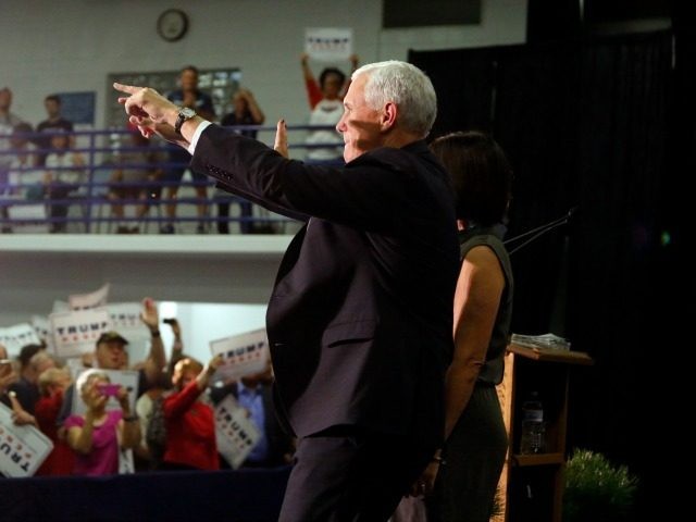 Republican vice presidential candidate Indiana Gov. Mike Pence greets supporters as he arr