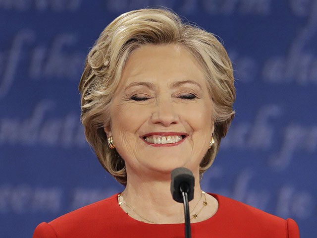 Democratic presidential nominee Hillary Clinton listens to Republican presidential nominee