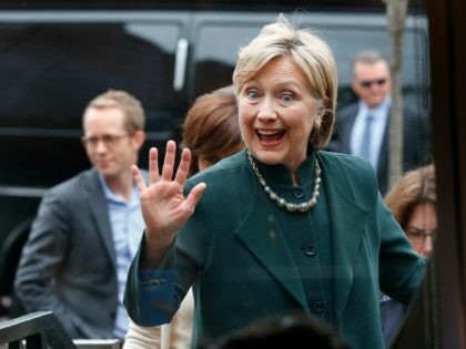 Democratic presidential candidate Hillary Clinton waves entering the Court Street Diner in