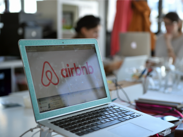A picture shows the logo of online lodging service Airbnb displayed on a computer screen i