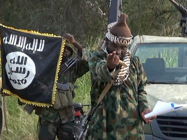 NIGERIA, Kano : A screengrab taken on October 2, 2014 from a video released by the Nigerian Islamist extremist group Boko Haram and obtained by AFP shows the leader of the Nigerian Islamist extremist group Boko Haram, Abubakar Shekau. Shekau dismissed Nigerian military claims of his death in a new …