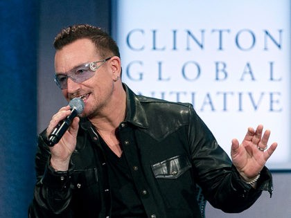 Rockers Bono and Bon Jovi help Bill Clinton bid farewell to Clinton Global Initiative.