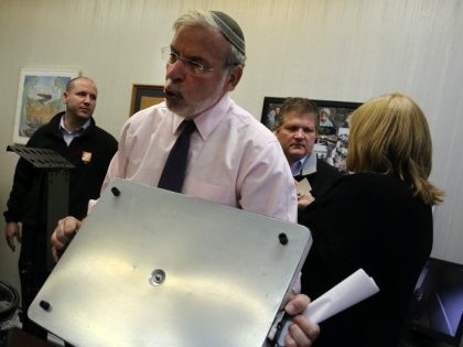 Assemblyman Dov Hikind holds a hot plate to show the dangers of leaving it unintended at a news conference following the fire that claimed the lives of seven children last Saturday in the Midwood neighborhood in Brooklyn on March 24, 2015 in New York City. Investigators say a hot plate …