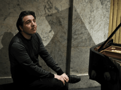 A photo taken on February 9, 2010 shows Turkish pianist and composer Fazil Say posing at the Theatre des Champs-Elysees in Paris. Fazil Say,charged with attacks on religious values for a series of provocative tweets about Islam, will go on trial from October 17, 2012. Under Turkish law, anyone convicted …
